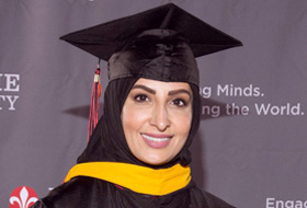 La Roche University alumna Shekhah Alrasheed in her cap and gown at commencement